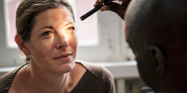 Woman at eye doctor