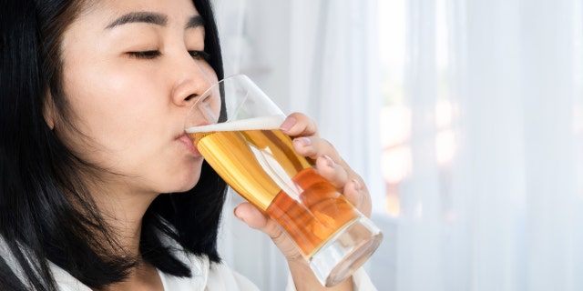 Woman drinking beer