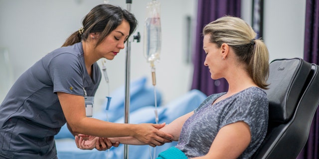 Woman getting IV treatment