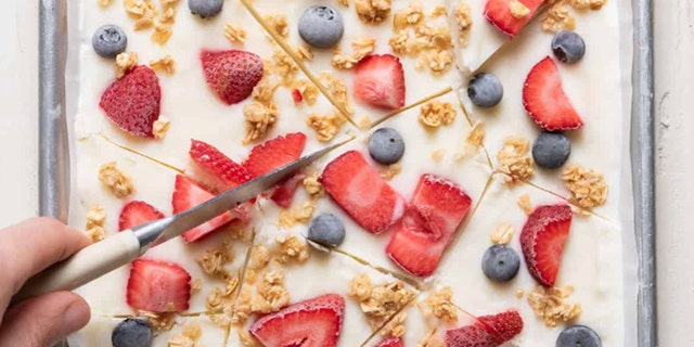 yogurt bark being cut