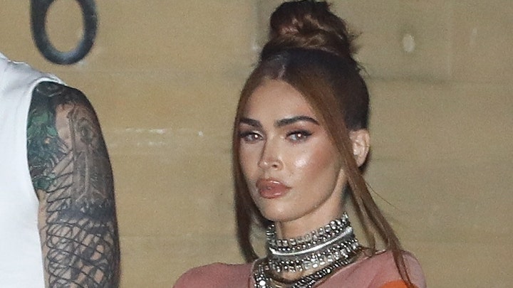 Machine Gun Kelly and Megan Fox walk the Grammy Awards red carpet together