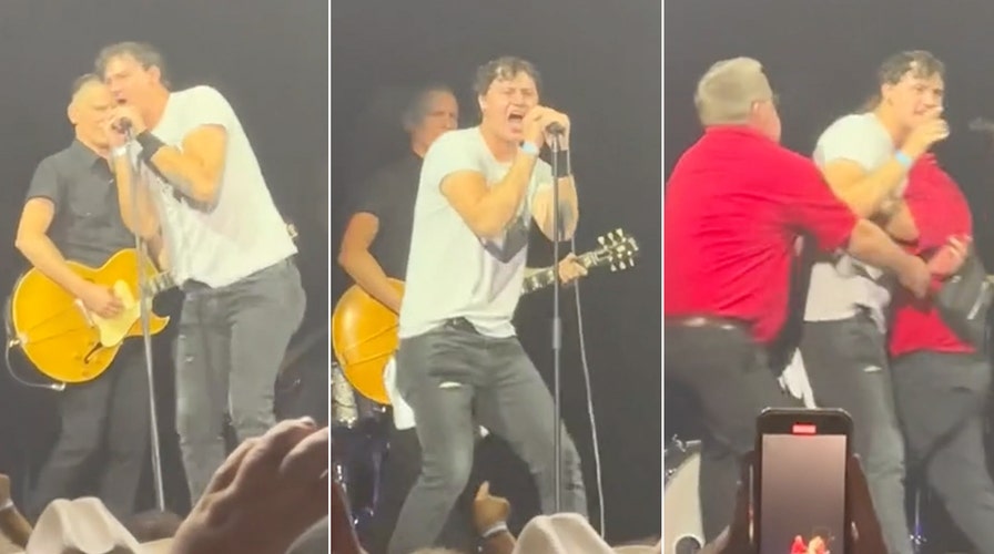 Bryan Adams ambushed on stage by unruly fan who gets tossed by security