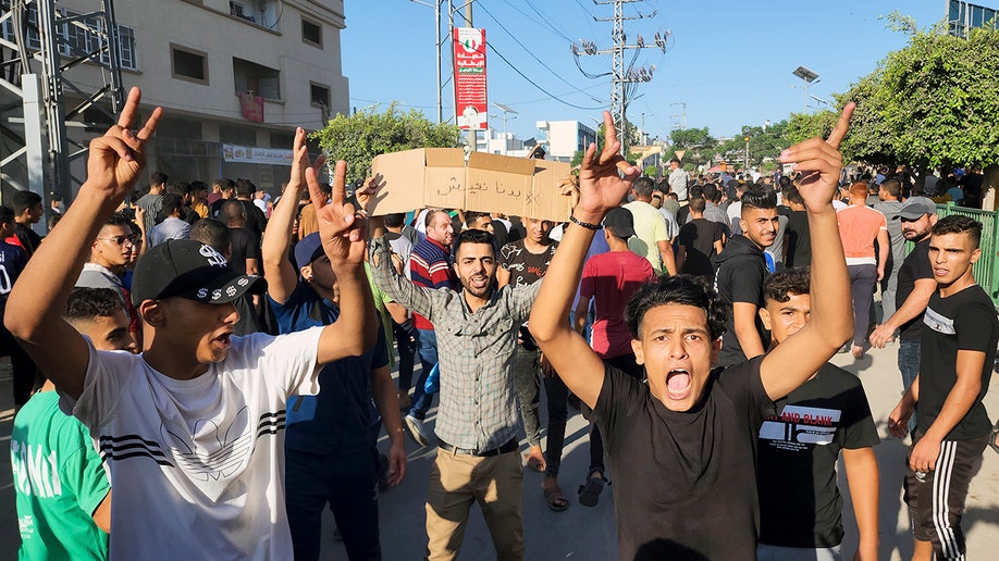 Palestinians chanting slogans in street