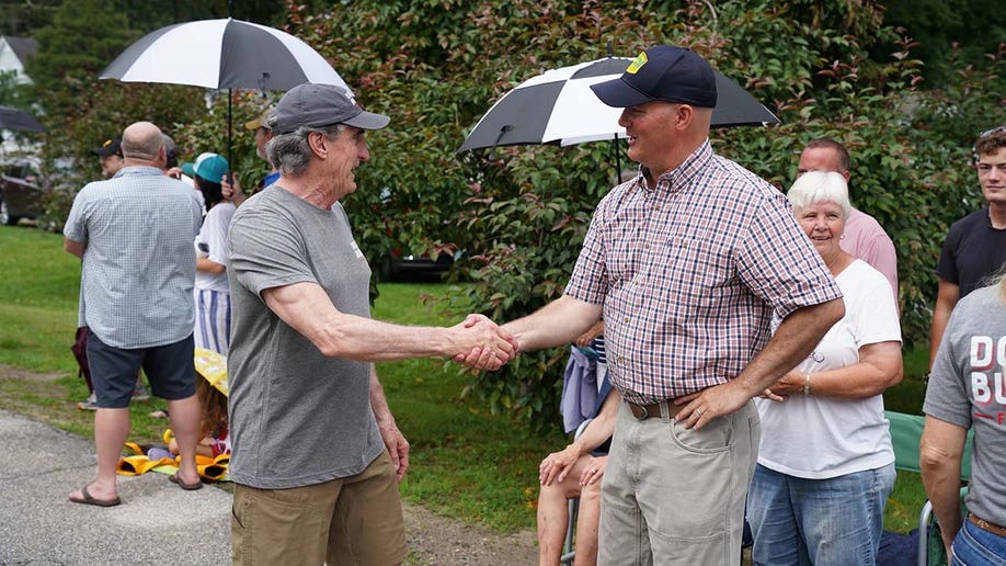 North Dakota Governor Doug Burgum greets supporters