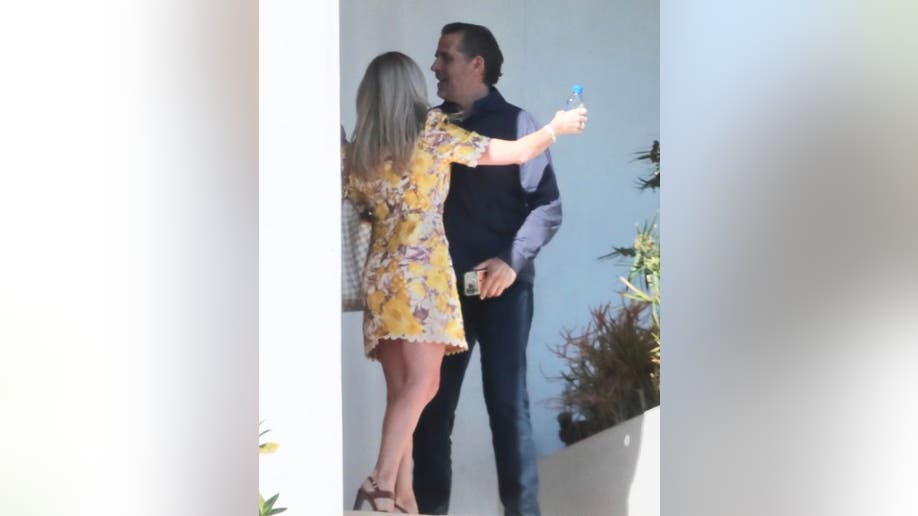 Hunter Biden hugs woman at his lawyer's house
