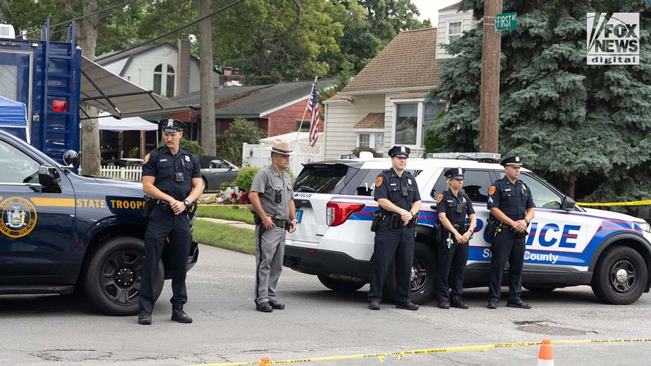 Authorities carry items out of Rex Heuermann's home in Massapequa Park