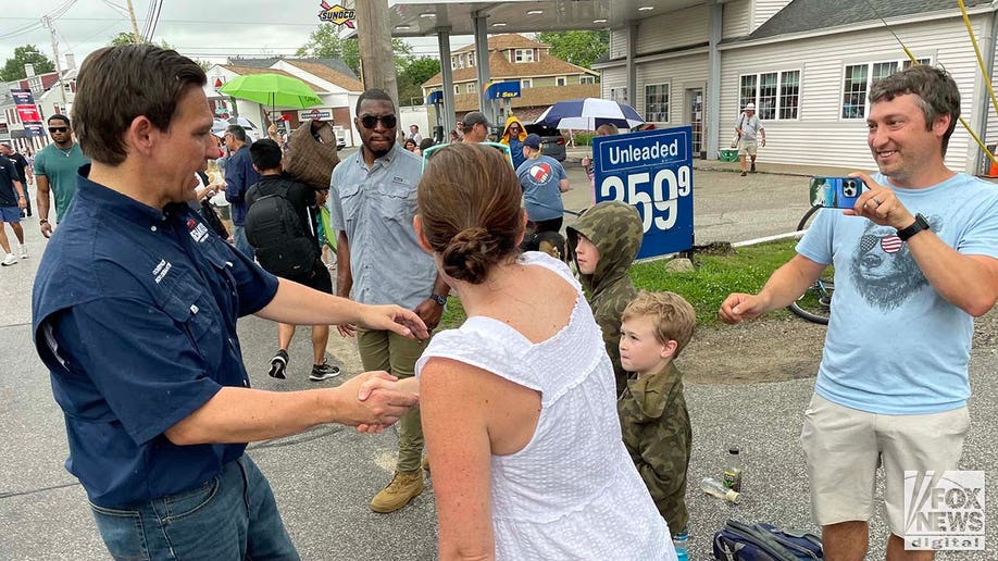 Florida Governor and presidential candidate Ron DeSantis takes pics