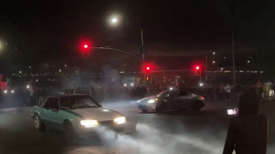 Cars doing donuts at intersection