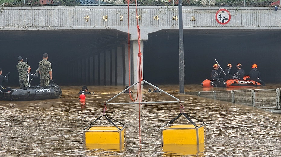 South Korean rescuers pull 9 bodies from flooded tunnel where 15 vehicles were trapped