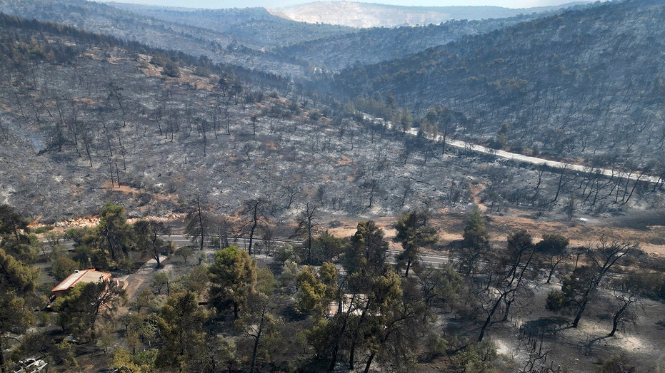 Firefighters contain major fire around Athens, fear extreme heat may cause new fires to erupt