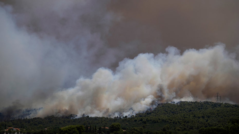 Highways closed, oil refinery threatened as Greek wildfires rage on