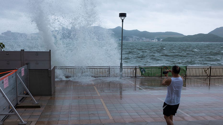 Typhoon Talim sweeps south of Hong Kong, prompting schools, stock market to close