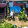 A police Investigator works in the backyard of Heuermann's home Friday,  July 14, 2023.