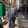Rex Heuremann in a suit near his office in Midtown Manhattan.