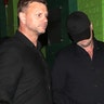 Leonardo DiCaprio leaving Mick Jagger's birthday party while covering his face