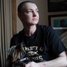 Sinead O'Connor posing for photos in her home