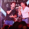 Tim McGraw and Richard Marx performing on stage