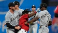 Cleveland Guardians' Jose Ramirez, center, and Chicago White Sox's Tim Anderson (7) exchange punches in the sixth inning of a baseball game Saturday, Aug. 5, 2023, in Cleveland.
