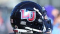 Liberty Flames helmet resting on a cooler during a college football game between the Virginia Tech Hokies and the Liberty Flames on November 19, 2022, at Williams Stadium in Lynchburg, VA.