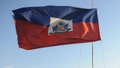 The Haitian flag is hoisted against a clear sky at the site of the presidential palace, Port-Au-Prince, Haiti, April 19, 2011
