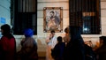 A priest blesses a visitor at the Church of San Cayetano, Buenos Aires, Argentina, Monday, Aug. 7, 2023.