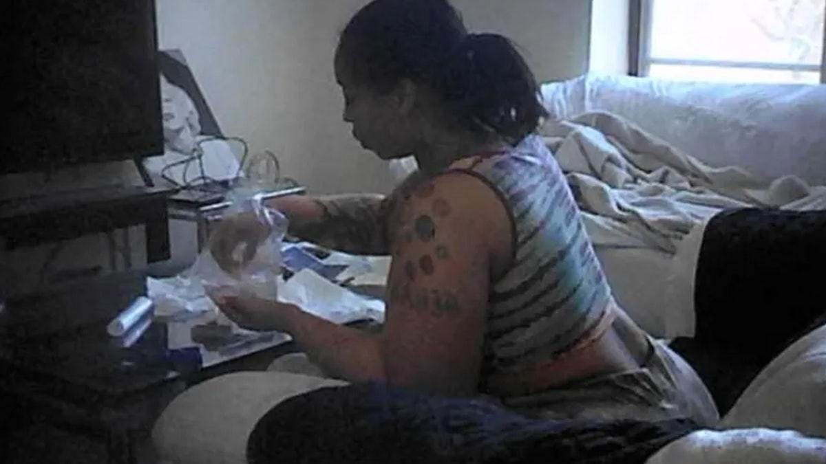 Suspect allegedly packing drugs