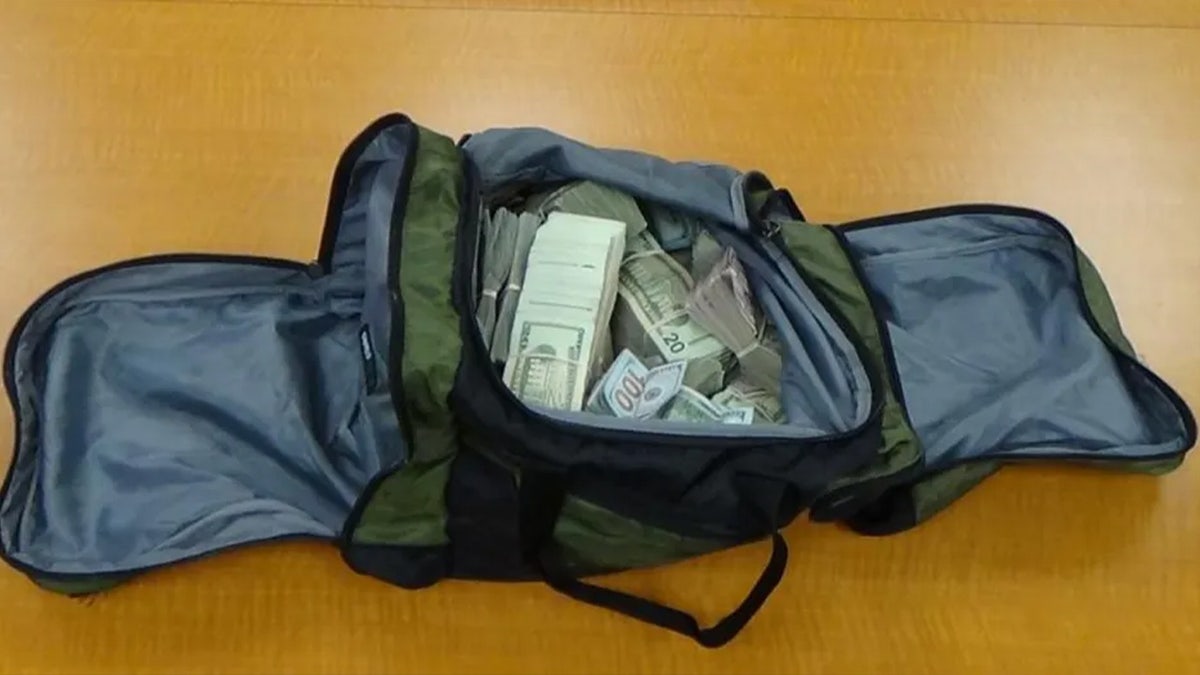 Duffel bag full of cash from drug bust