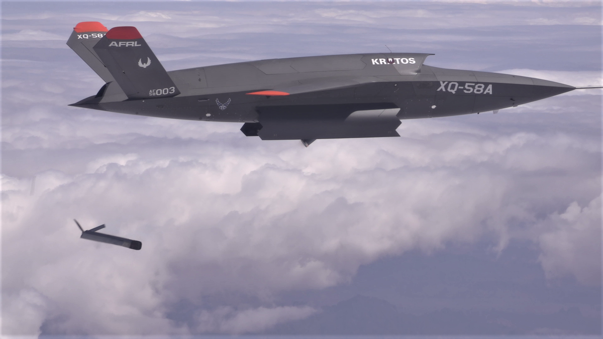 unmanned drone being released from XQ-58A Valkyrie in flight