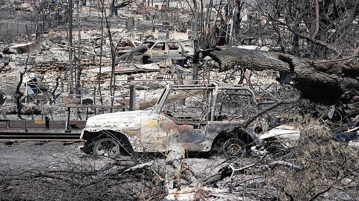 Burned cars and buildings in Lahaina, Hawaii
