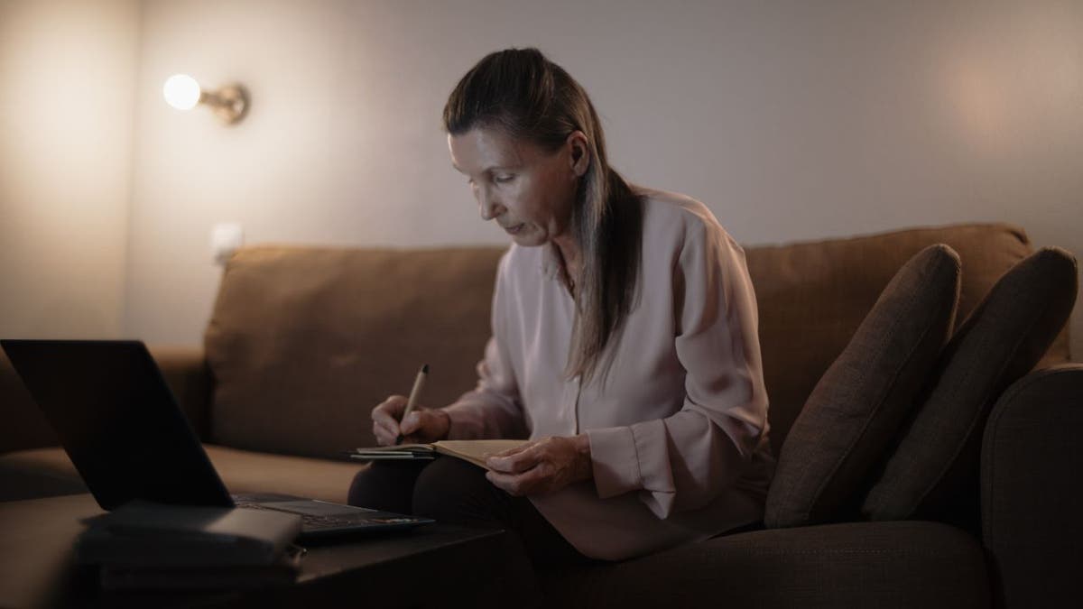 Woman doing her research on what scams to look out for.