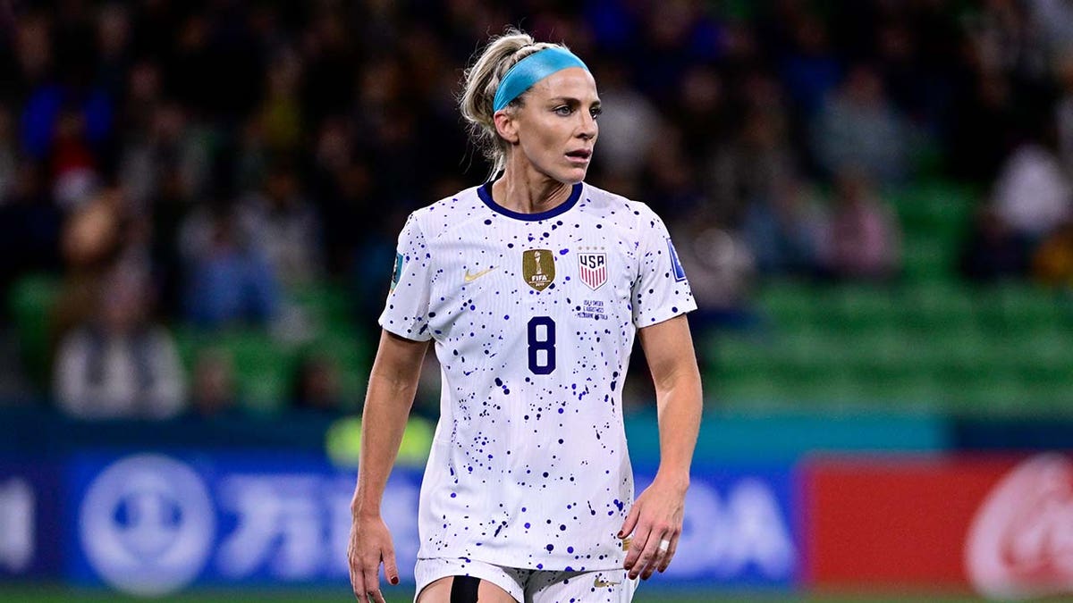 Julie Ertz defends during a game