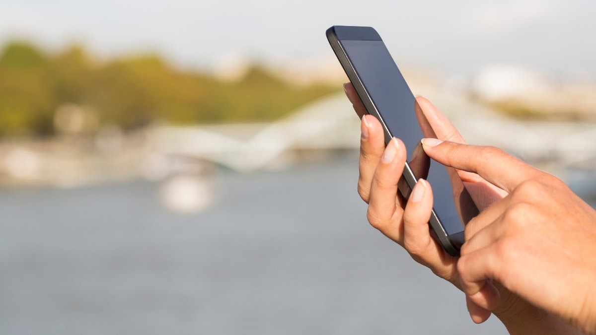 Woman using her phone.