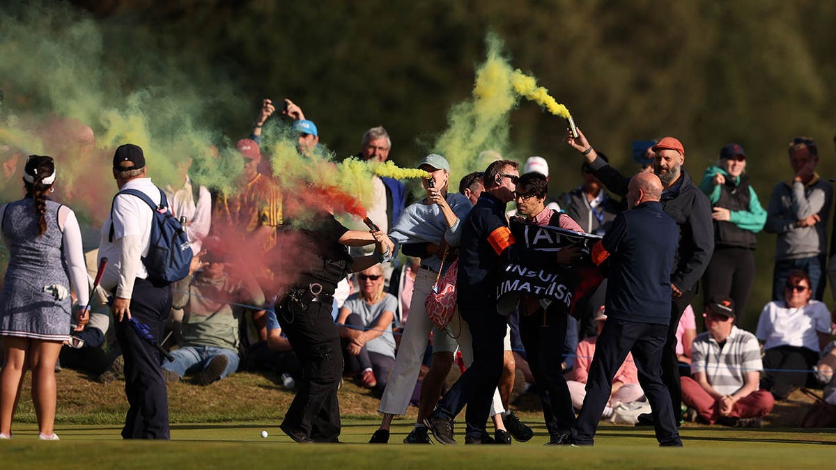 Protesters disrupt the final round of the AIG Women's Open