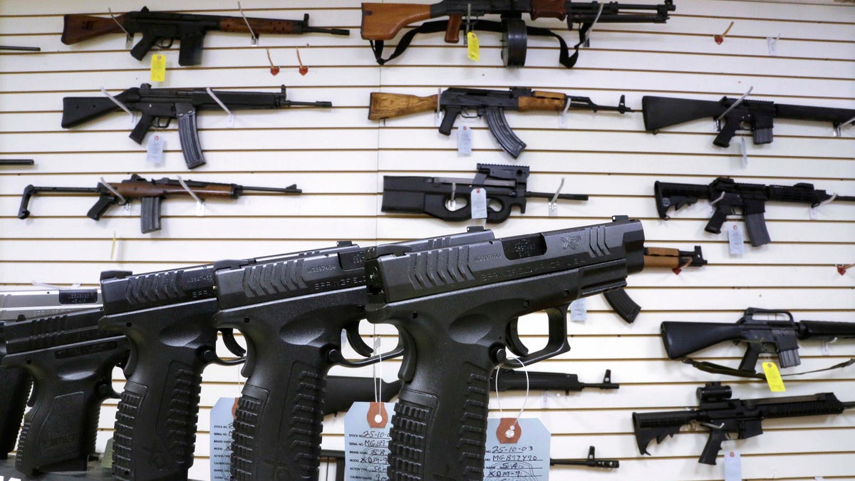 Pistols and rifles on display in an Illinois gun store