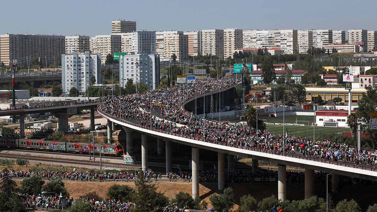 People standing on a bridge