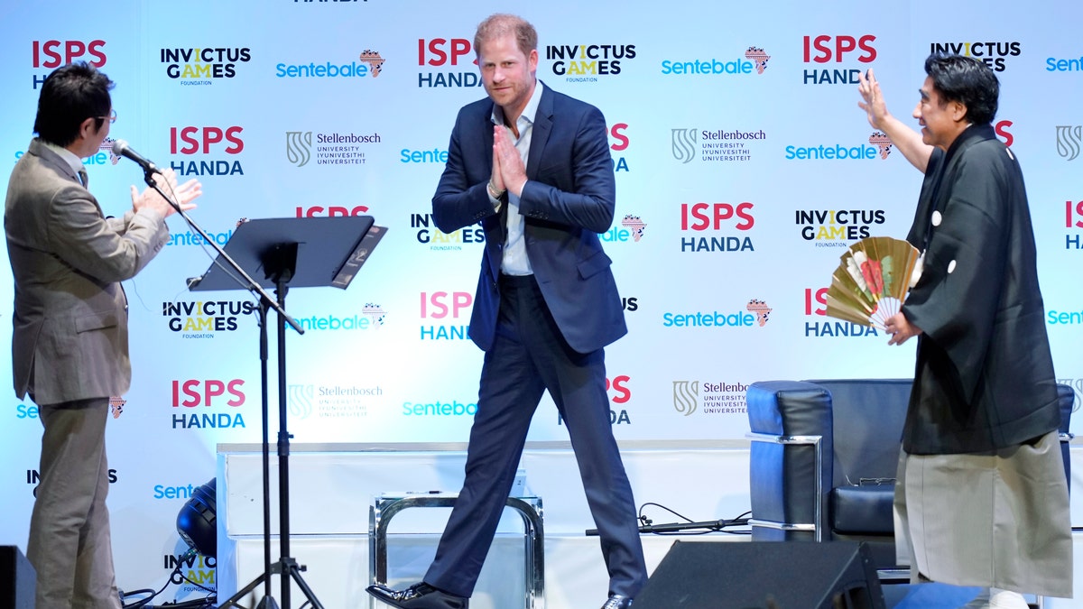 prince harry walking on stage at sports summit