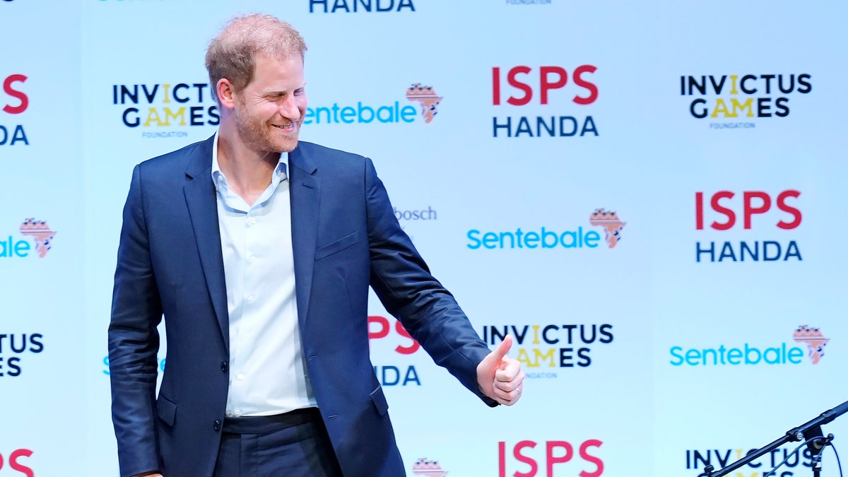 prince harry taking the stage at the sports summit in japan