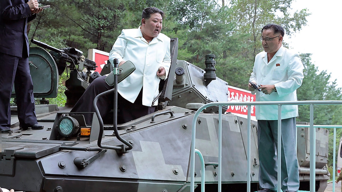 Kim Jong-Un on a vehicle