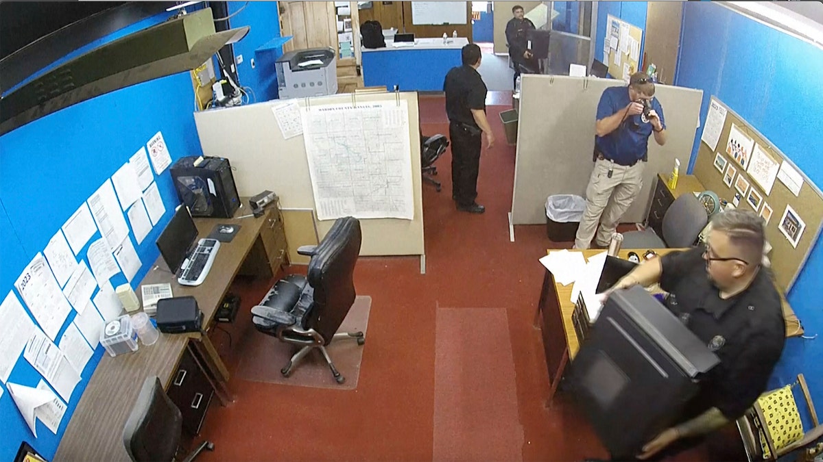 surveillance video shows Marion Police Department confiscating computers from the Marion County Record office in Kansas