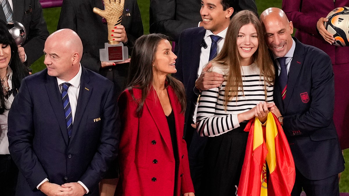 Spanish officials on a podium