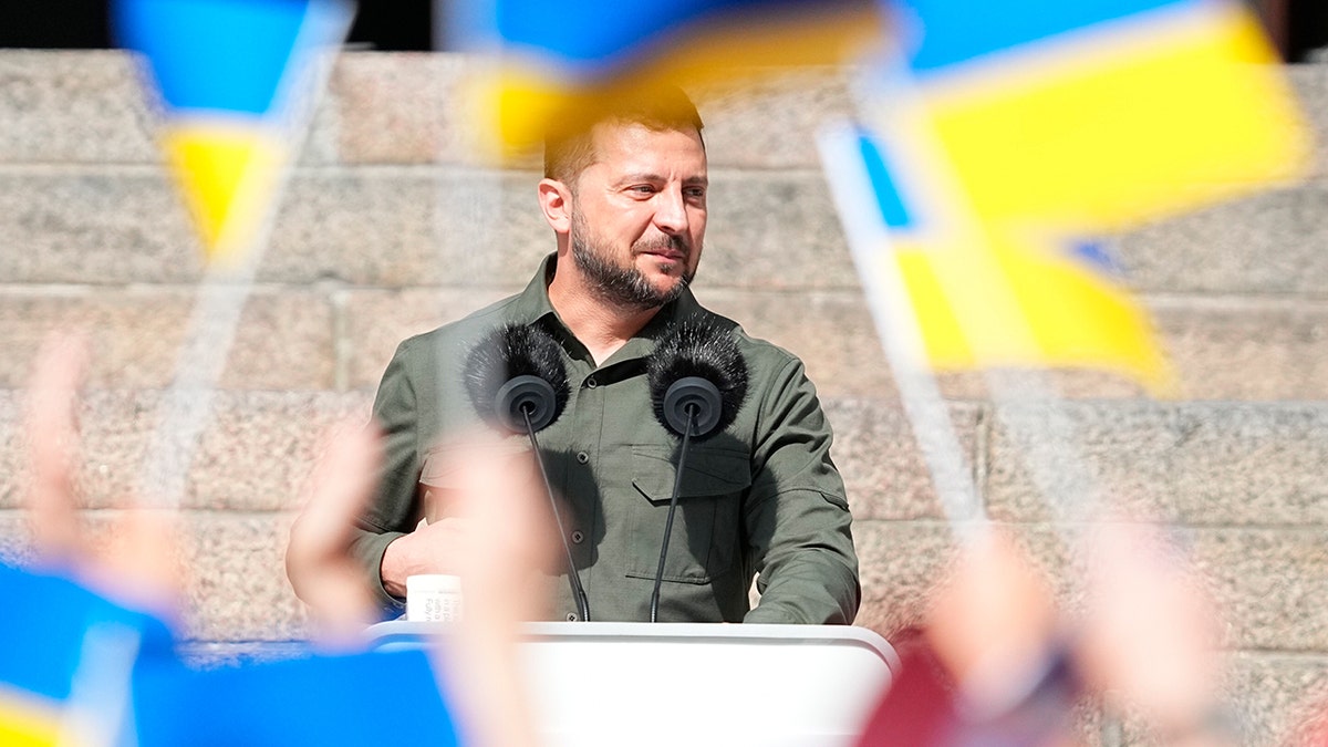 Zelenskyy at a podium