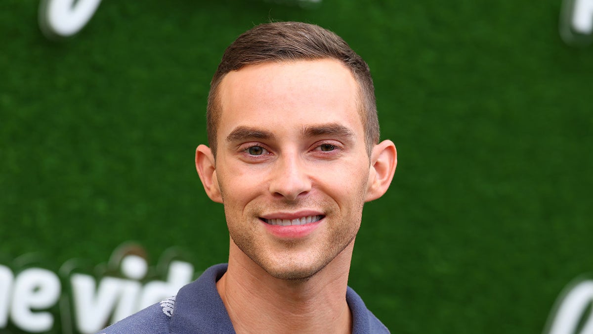 Adam Rippon poses