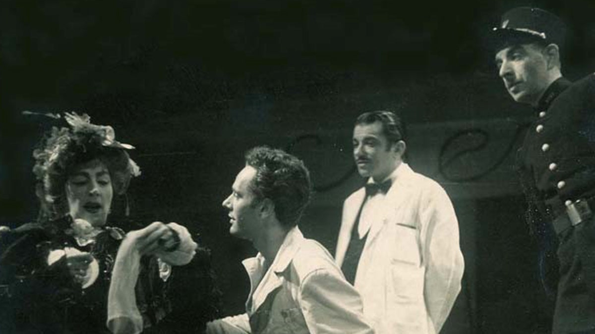 A young Alan Shayne performing on stage with an actor and actress wearing a white shirt