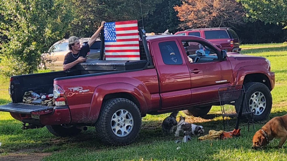 flag displayed in bed of pickup