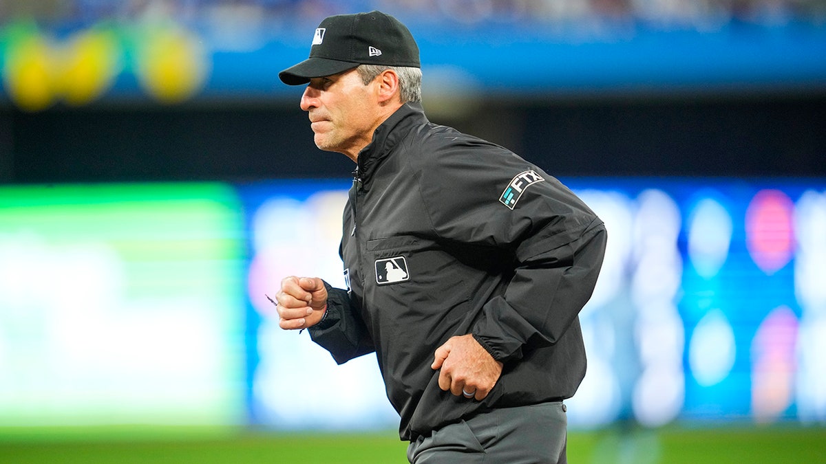 Angel Hernandez runs on field
