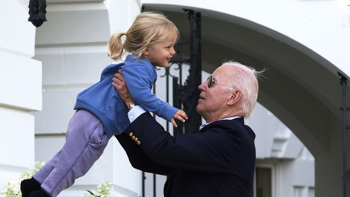 Biden with a grandchild