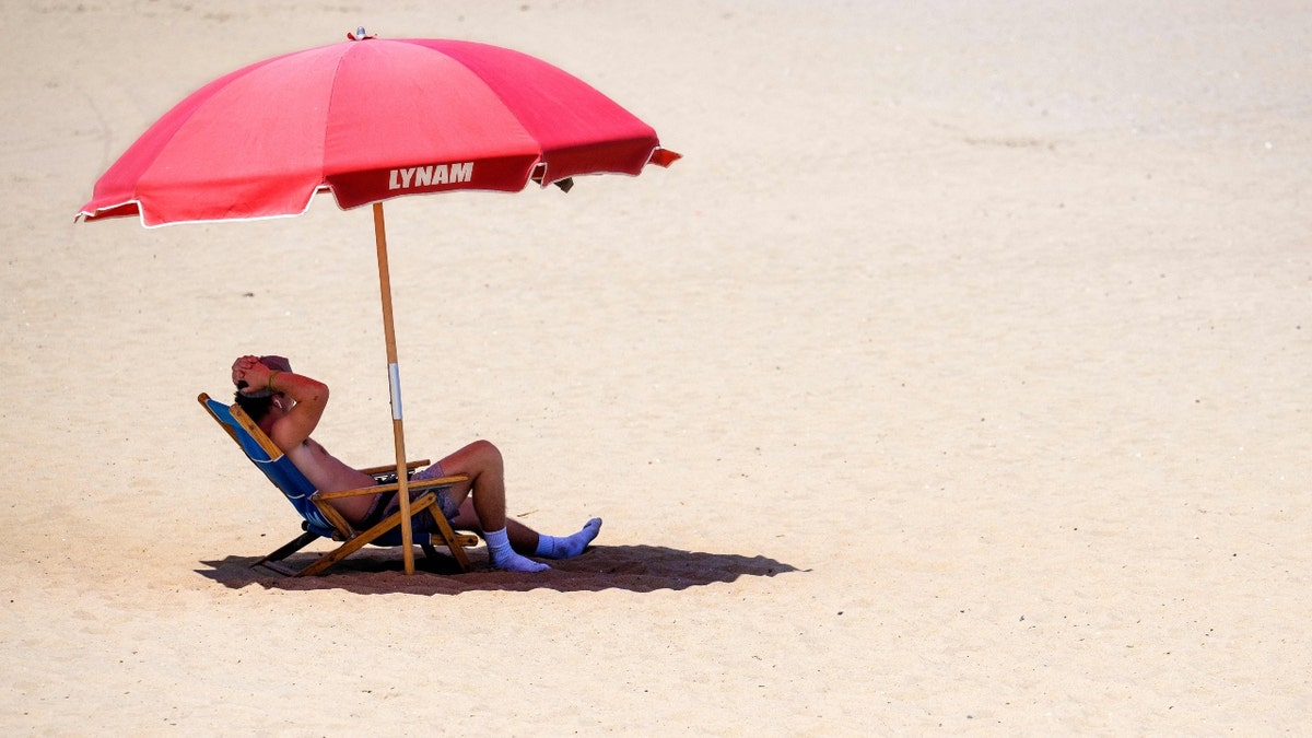 A Delaware beachgoer in the heat