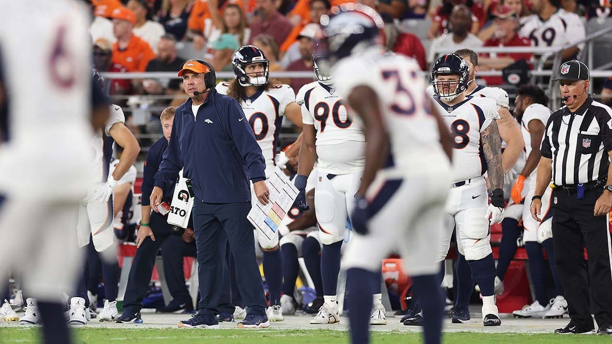 Sean Payton watches from the sidelines during a preseason game