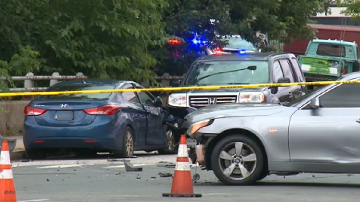 Three cars in a car accident, police tape line do not cross around the scene