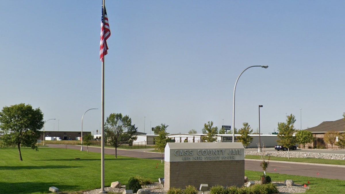 Google Maps screenshot of Cass County Jail sign, American flag